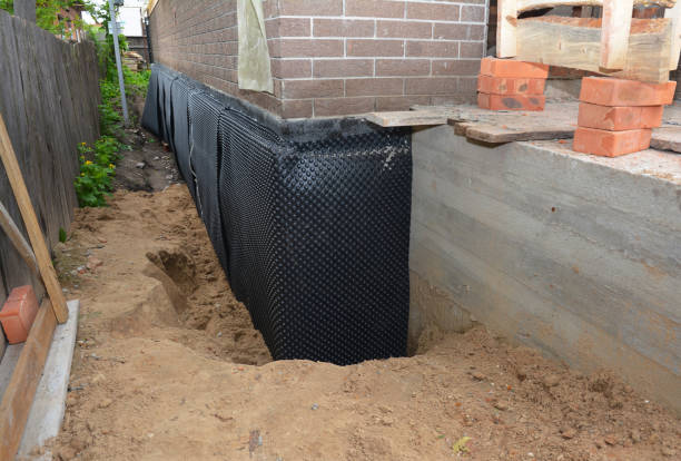 SJ Waterproofing Pros technician performing targeted Interior Drainage System assessment in Mattawan, MI